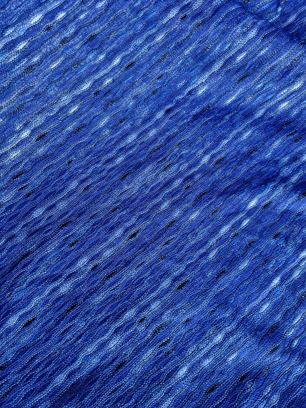 Photo réelle du tissu bleu à texture ondulée